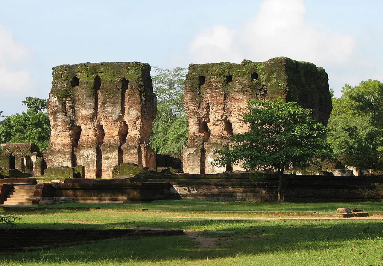 The tall brick walls of the ruined Royal Palace of King Parakramabahu standing over open lawns