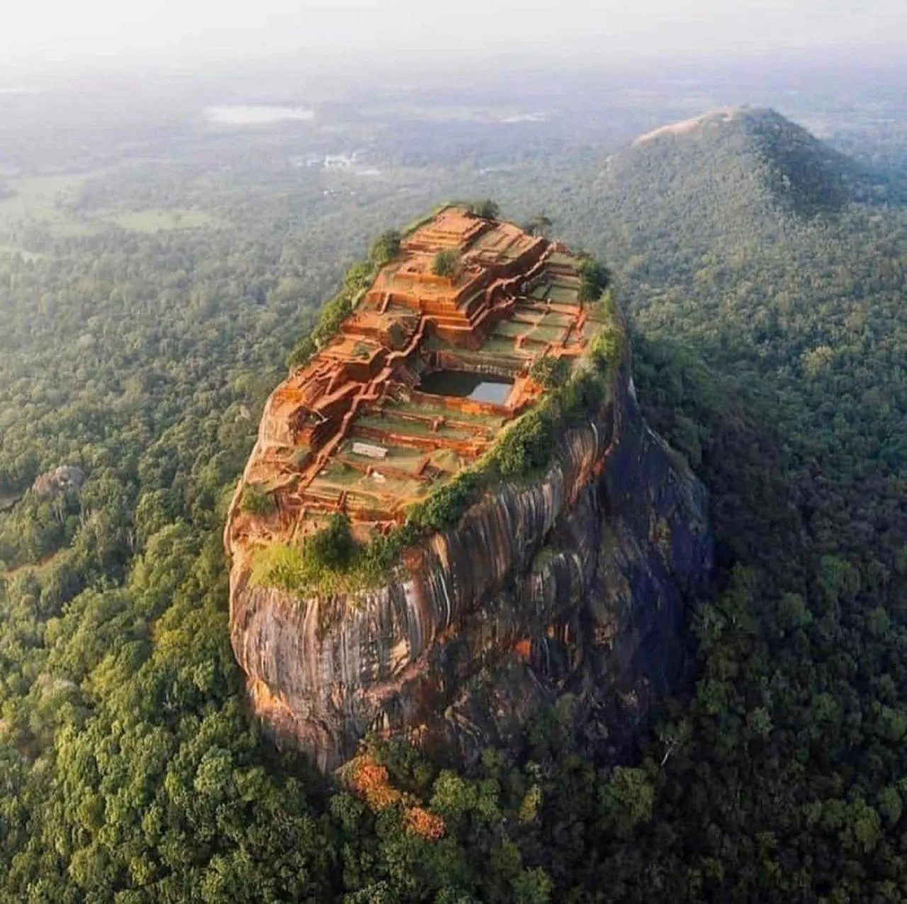 Aerial view of the terraced summit ruins and water tank on top of Sigiriya rock